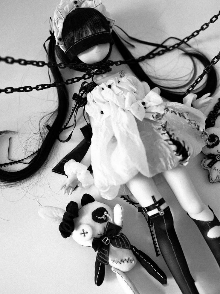 a pretty doll in chains