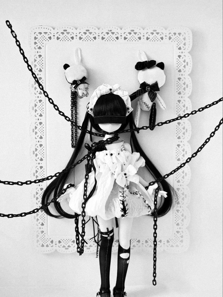 a pretty doll in chains, from another angle