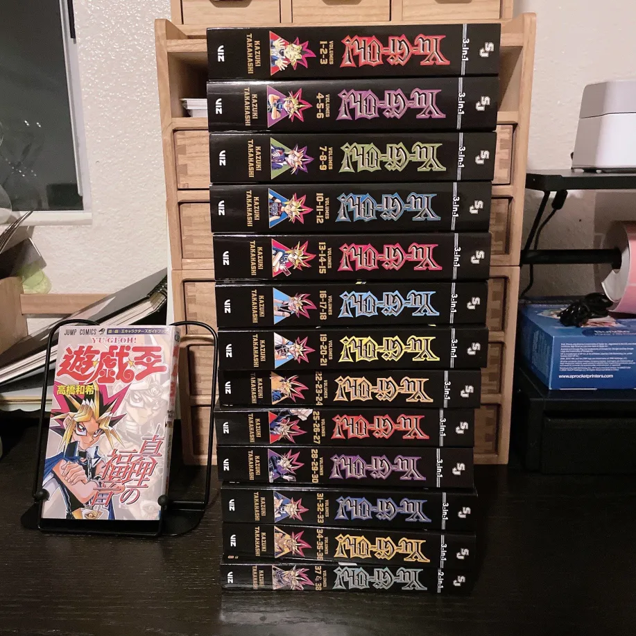big stack of YU-GI-OH! manga